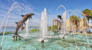 Large fountain with statues of dolphins image